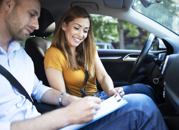 Car instructor explaining city traffic rules before driving a ca